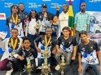 A group picture of the participants with their trophies