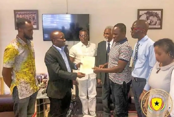 NSA chief, Prof. Peter Twumasi presents certificate of recognition to the Ghana Jiu Jitsu Federation