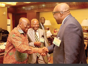 President Akufo-Addo shakes the hand of Mr Kobby Andah