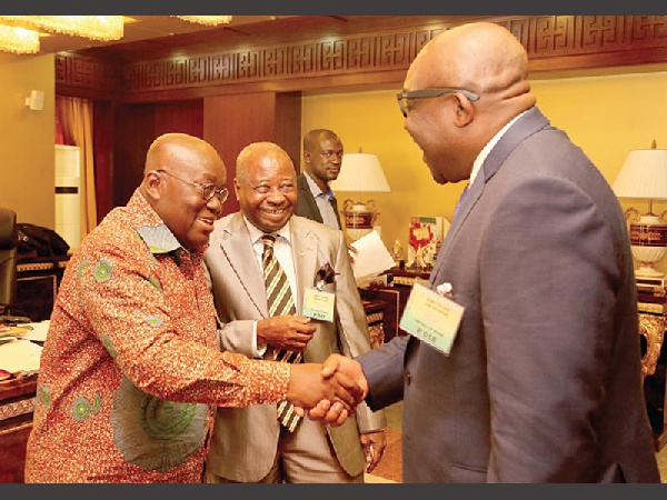 President Akufo-Addo shakes the hand of Mr Kobby Andah