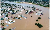 Houses are partially submerged following a dam collapse in Maiduguri, Nigeria, Tue, Sept 10, 2024