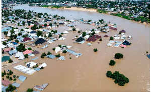 Houses are partially submerged following a dam collapse in Maiduguri, Nigeria, Tue, Sept 10, 2024