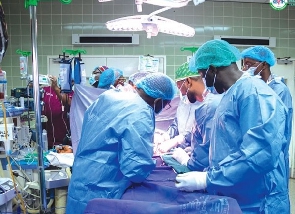 A team of doctors performing a medical procedure