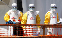 Health workers in protective suits are seen at the newly constructed Ebola treatment centre in Goma