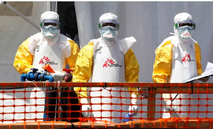 Health workers in protective suits are seen at the newly constructed Ebola treatment centre in Goma