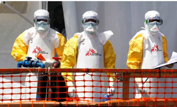 Health workers in protective suits are seen at the newly constructed Ebola treatment centre in Goma