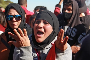 People demonstrate against a rubbish dump in the Tunisian town of Aguereb