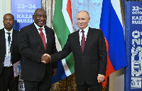 South African President Cyril Ramaphosa (L) meets with Russian President Vladimir Putin