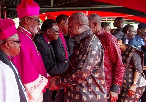 File photo: President John Mahama exchanges pleasantries with some members of the clergy.