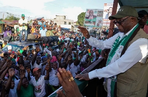 Liberia's opposition leader Joseph Boakai of Unity Party waves to his supporters