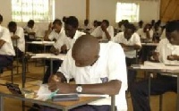 Students writing Examination.