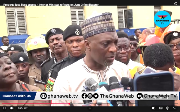 A picture of the Interior Minister addressing the media during his visit to the scene