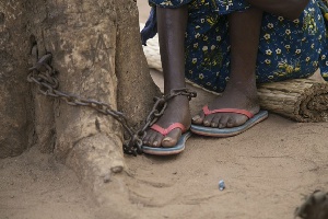 A chained mentally challenged person