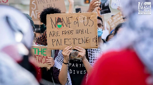 Activists march with supplies toward Palestinian homes besieged by Israeli settlers