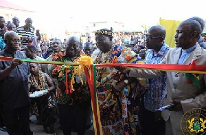 President Akufo-Addo cutting the tape for the Anlo Shopping Centre with some chiefs