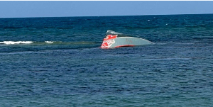 A portion of the capsized vessel floats near Guhere, north of the port town of Obock, Djibouti