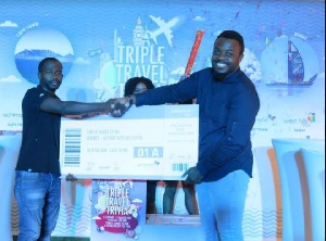 Marketing Manager Anthony Asamoah hands over award to winner of Achimota Mall