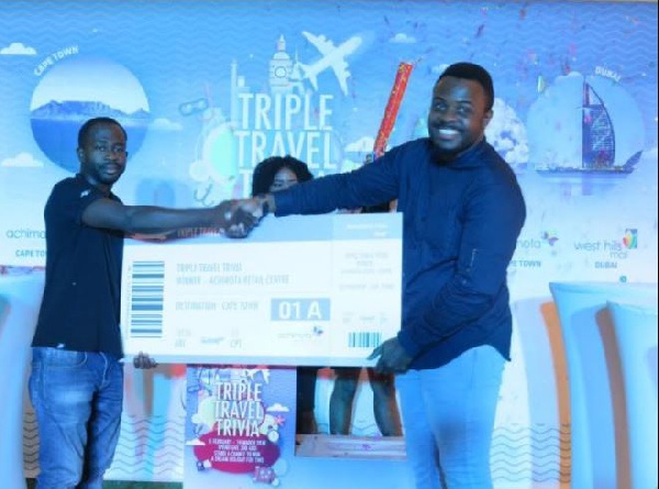 Marketing Manager Anthony Asamoah hands over award to winner of Achimota Mall