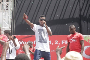 Kofi Kinaata on stage at Kaneshie market