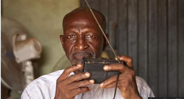 Baba Bala spends most of his time at the shop listening to the news on his radio