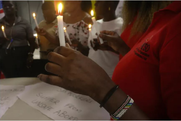 A vigil for women who died from unsafe abortions in Kampala [Sophie Neiman/Al Jazeera]