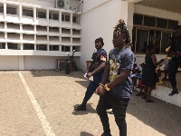 Wisa Greid being led away after he failed to pay the fine and also meet the bail term