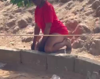 The young woman was found kneeling and hanging by a tree in the family compound