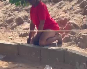 The young woman was found kneeling and hanging by a tree in the family compound