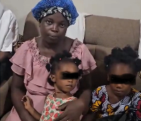 Screen shot from video of Maame Atta with children