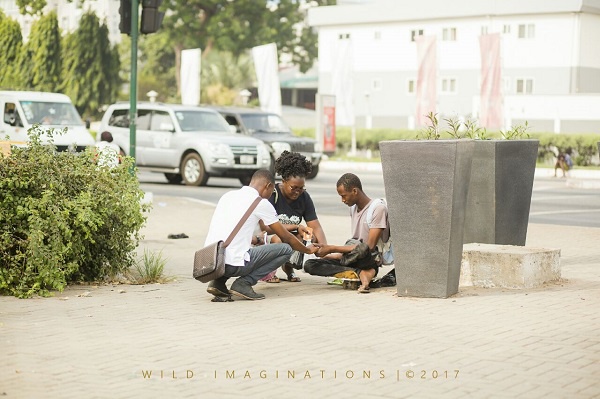 Some members of ROWM praying and sharing the Word with a man on the streets