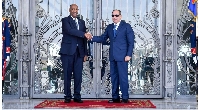 General Abdel Fattah al-Burhan (L) shakes hands with Egyptian President Abdel  Fattah al-Sisi