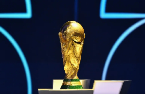 The FIFA World Cup Trophy displayed on a podium during the draw for the 2026 FIFA World Cup