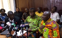Mr David Ofori Acheampong (right), General Secretary of GNAT, speaking at a news conference