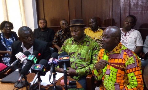 Mr David Ofori Acheampong (right), General Secretary of GNAT, speaking at a news conference