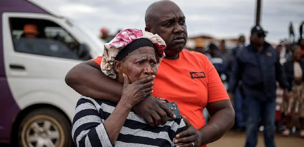 Bekkersdal residents at the scene of the shooting