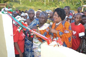 Queenstar Sawyer, MP for Agona East cutting the tape with the chief of Agona Abosomasi