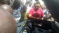 Otumfuo (left) checking engine of one of the cars