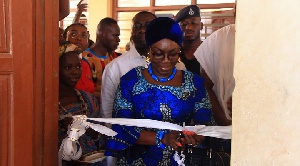 Ursula Owusu-Ekuful cutting the sod for the project
