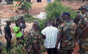 Soldiers at the scene of the murder of Captain Mahama