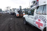 An International Committee of the Red Cross convoy escorts the now-unarmed Congolese soldiers