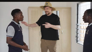 Mr Beast handling the newly-built bungalows to the teachers