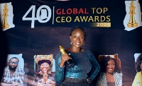 Nana Akua Akuffo displaying her award