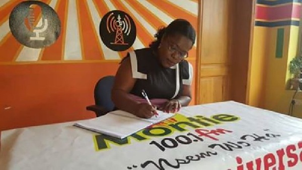 Nana Oye Lithur signing a petition for President Mahama to pardon the contemnors.