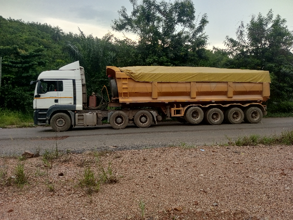 A tipper truck hauling limestone from the Odugblase mines