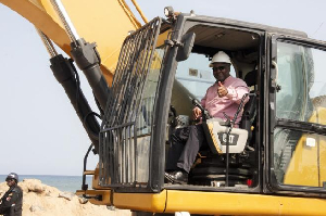 President Mahama operates a caterpillar at the Blekusu project launch