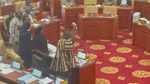 Minority Leader Alexander Afenyo-Markin (R) the money at Parliament