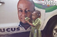 The unnamed school girl trying to feed Mahama's picture