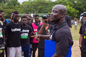 BTS icon Stephen Appiah talking to the young footballers