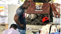 A citizen having his Ghana Card checked
