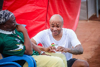 Abedi Pele and André Ayew share a light-hearted laugh during a conversation at Nania Park